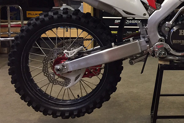 Dirt bike back wheel in shop
