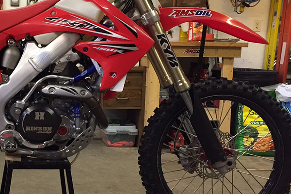 AMSOIL l Hinson dirt bike in shop 