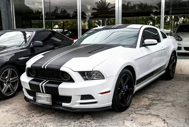 car parked outside car dealership