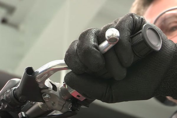 dirt bike brakes and handles being tested in shop